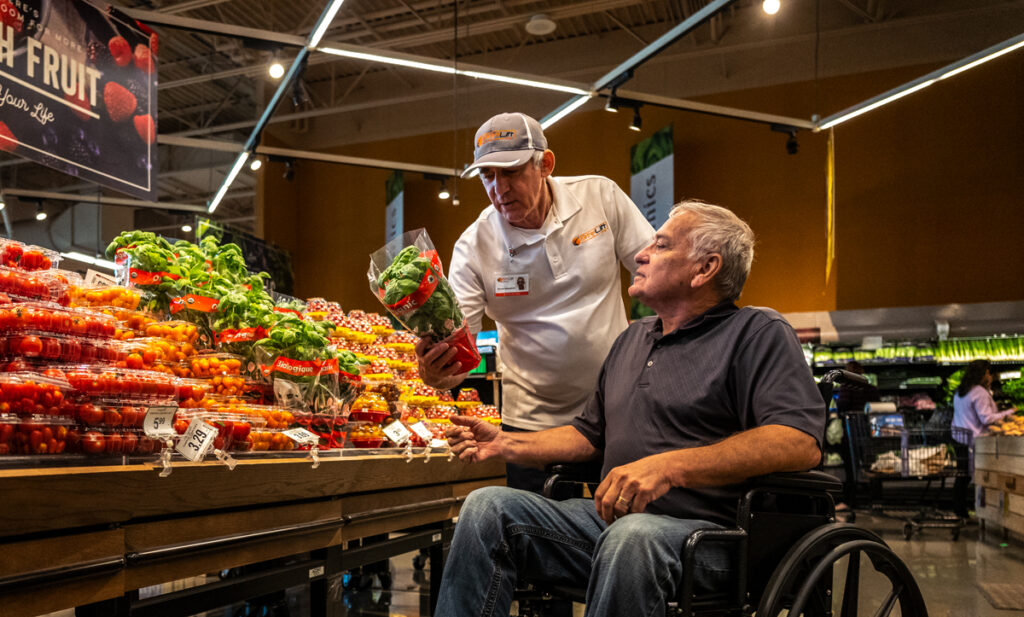 Wheelchair User Getting Door-Through-Door Handicap Transportation Service in Grocery Store